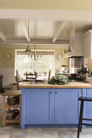 blue cupboards in kitchen extension to 1700s new england farmhouse