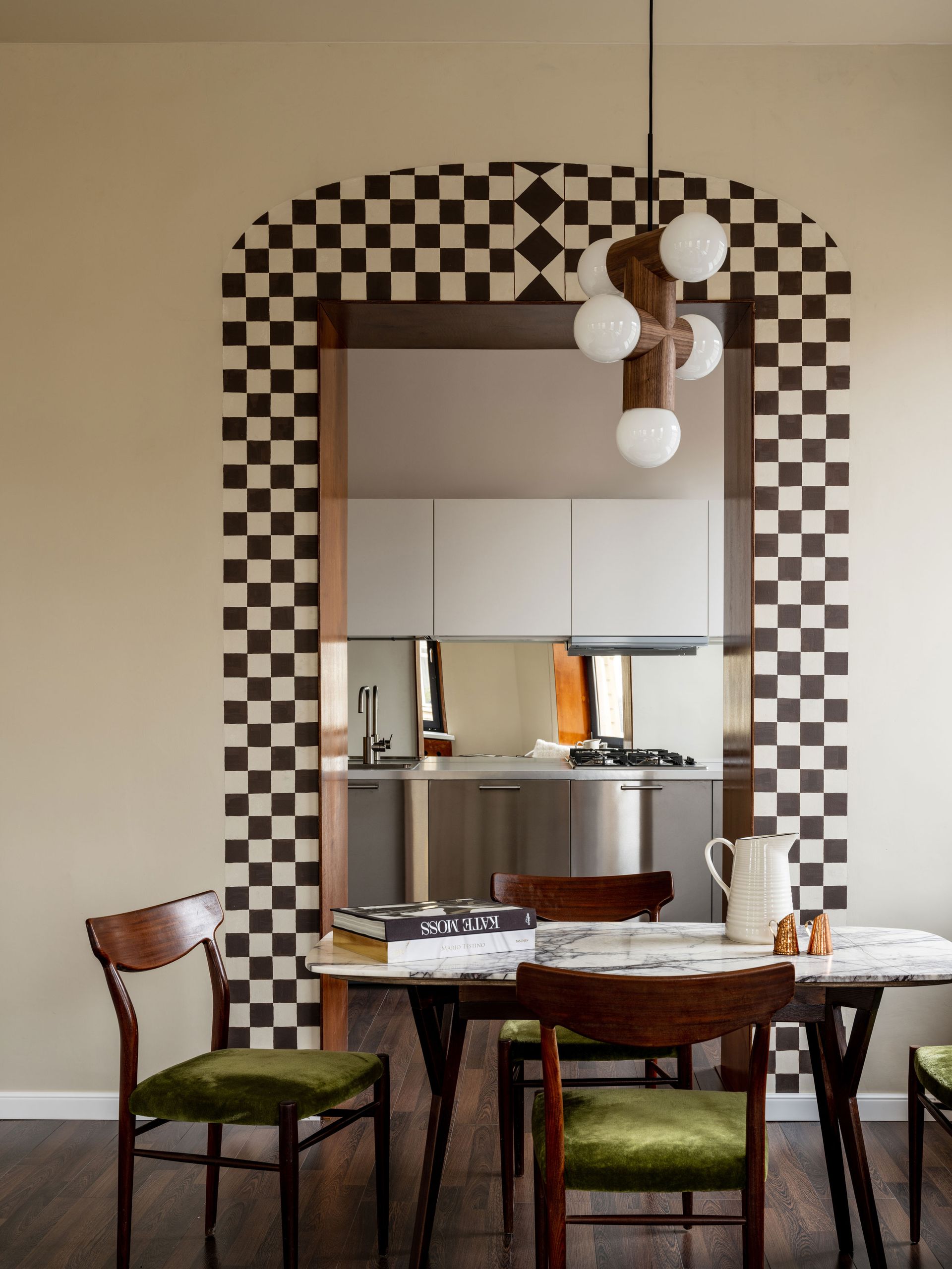 a checkerboard painted doorway in an apartment