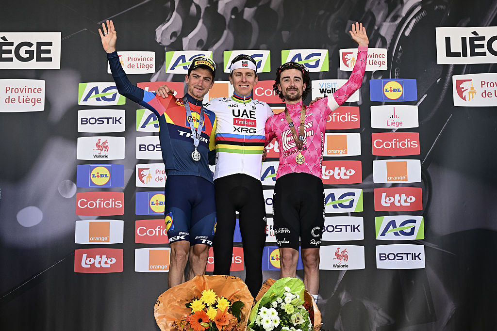 Giulio Ciccone, Tadej Pogacar and Ben Healy celebrate on the podium after the 2025 Liege-Bastogne-Liege 