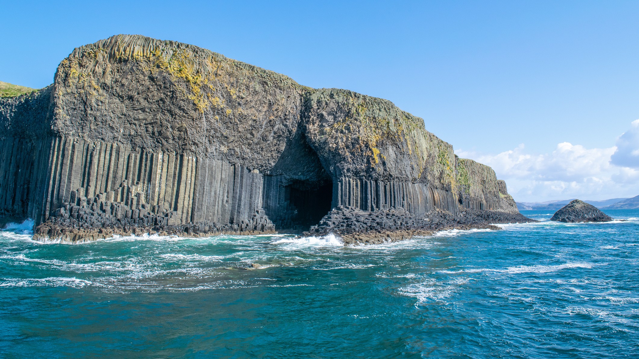 Fingal's Cave in Scotland viewed from the ocean.