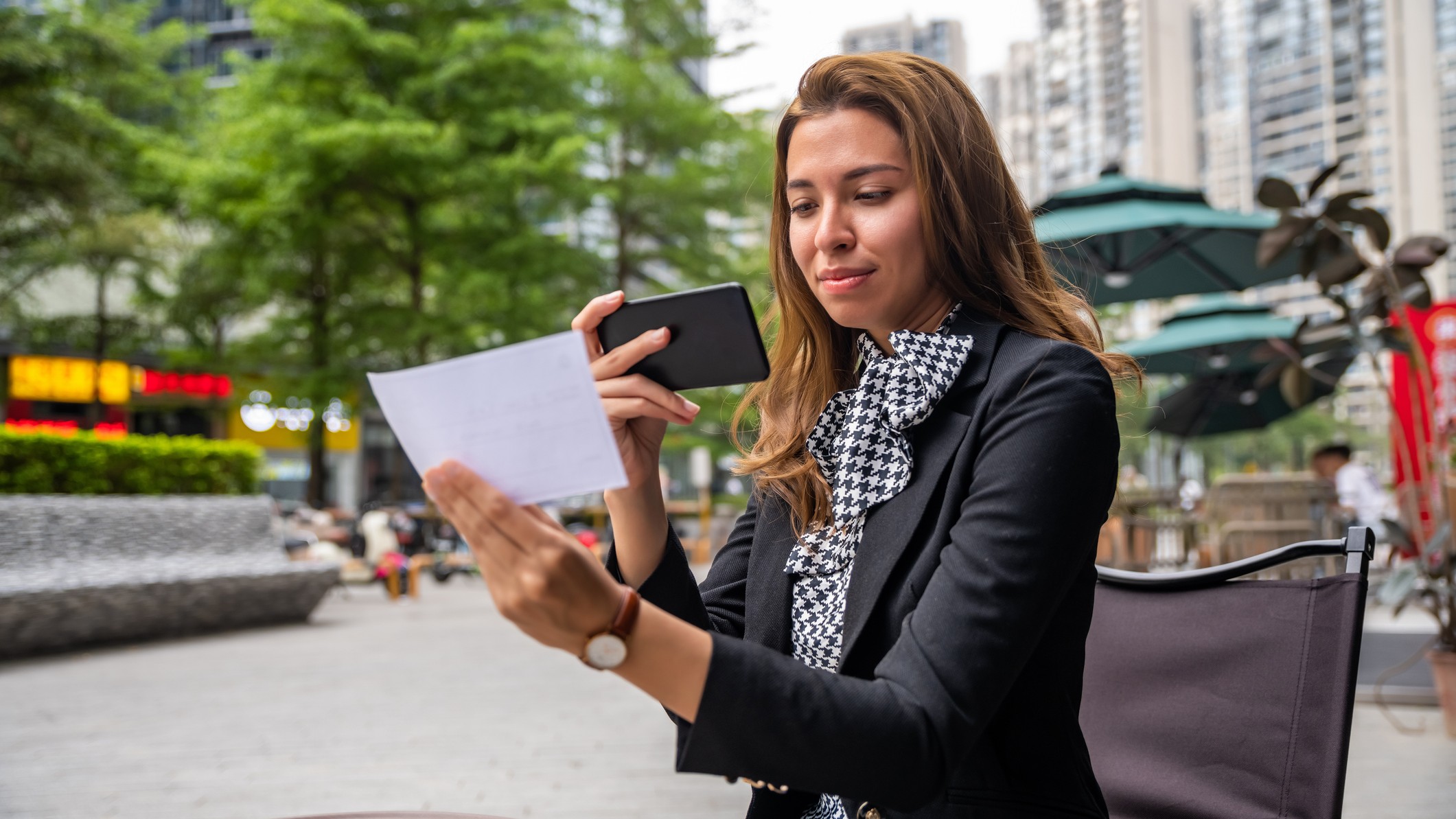 a woman tries to mobile deposit a check 