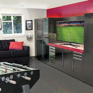 football room with game table and cabinets with big tv screen