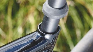 The seat tube is markedly bigger than the seatpost to aid movement
