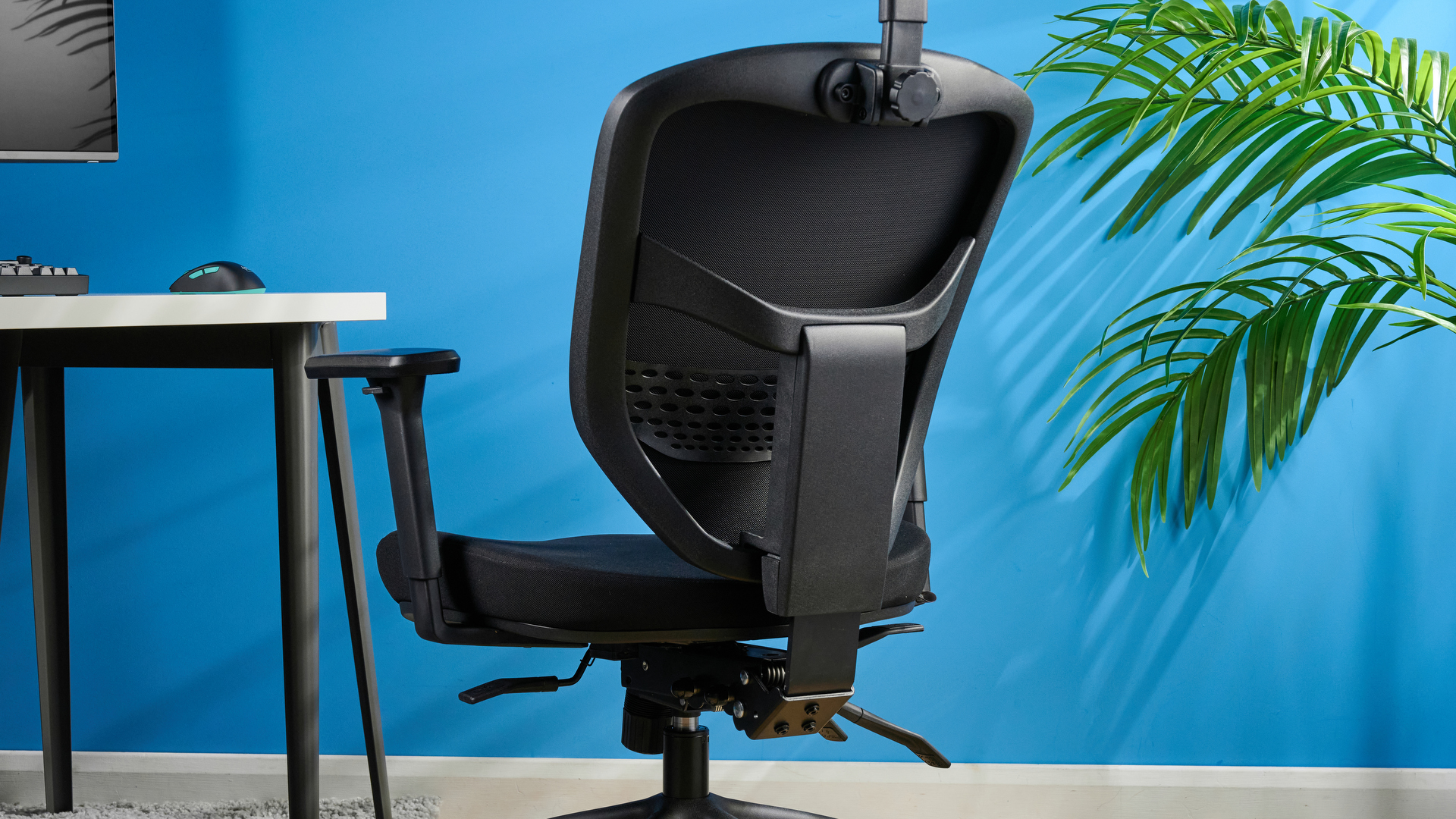A black Boulies OP300 ergonomic office chair