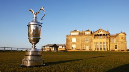 Claret jug trophy pictured in front of the R&A clubhouse