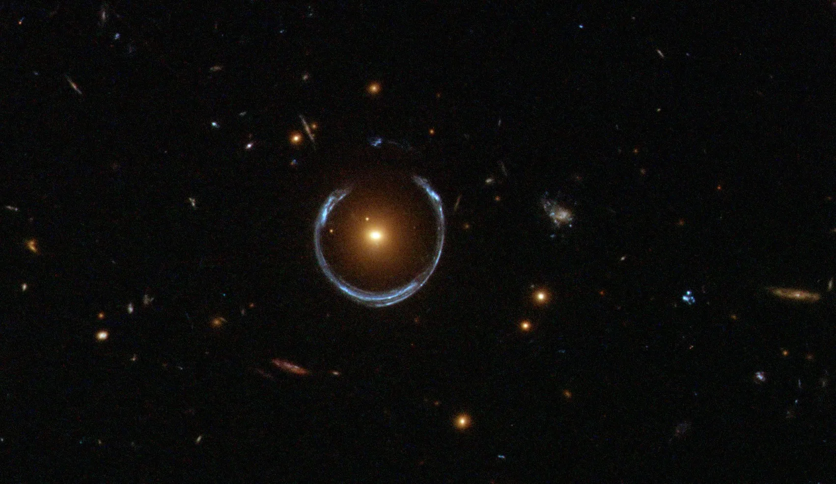 A bright yellow blob surrounded by a warped blueish line in the shape of a horseshoe.