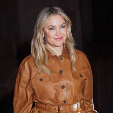 Kate Hudson wearing a brown leather jacket