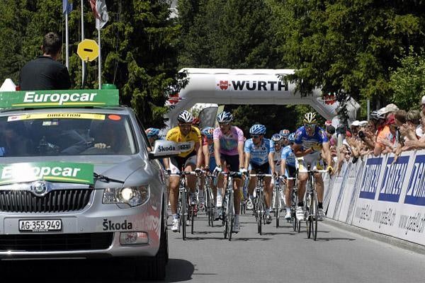 The peloton eases off the start line for stage two.