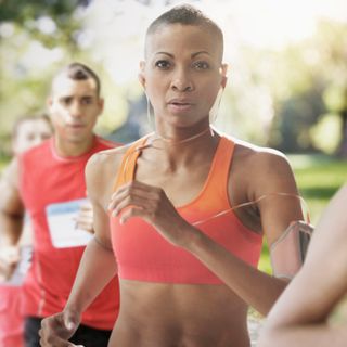 Fit athletic woman attending running race