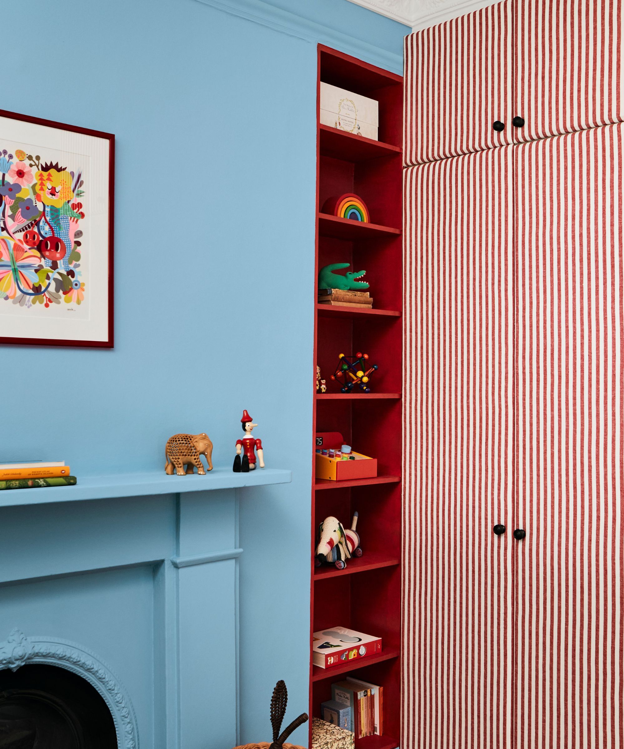 A child's bedroom painted in vivid blue and red