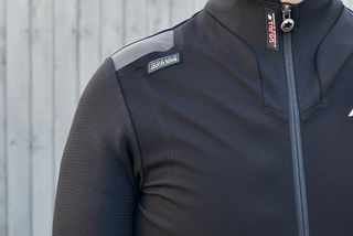 Image shows a rider wearing the Assos Equipe RS Johdah S9 Targa Winter Jacket
