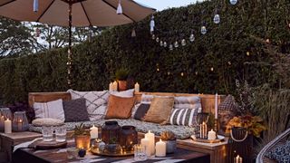 Outdoor-seating-in-garden-with-lighting-and-candles---Pic-credit-Lights4Fun