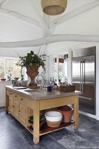White kitchen with pale yellow island