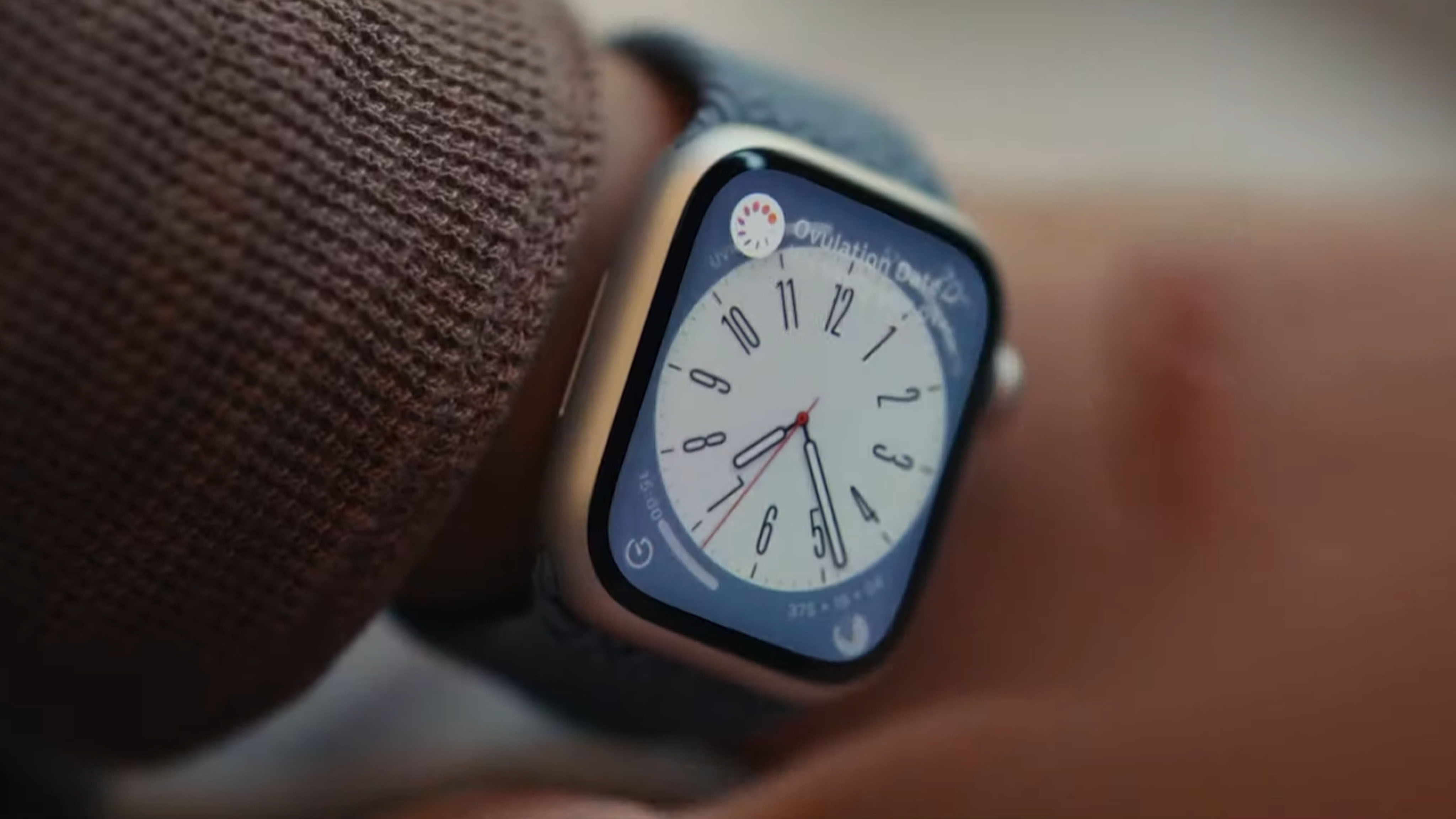 Apple Watch on arm clock