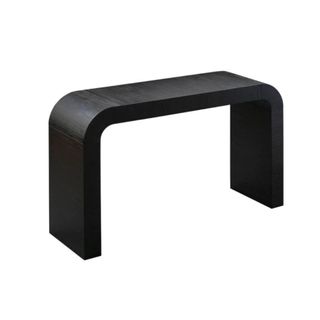 A black curved console table
