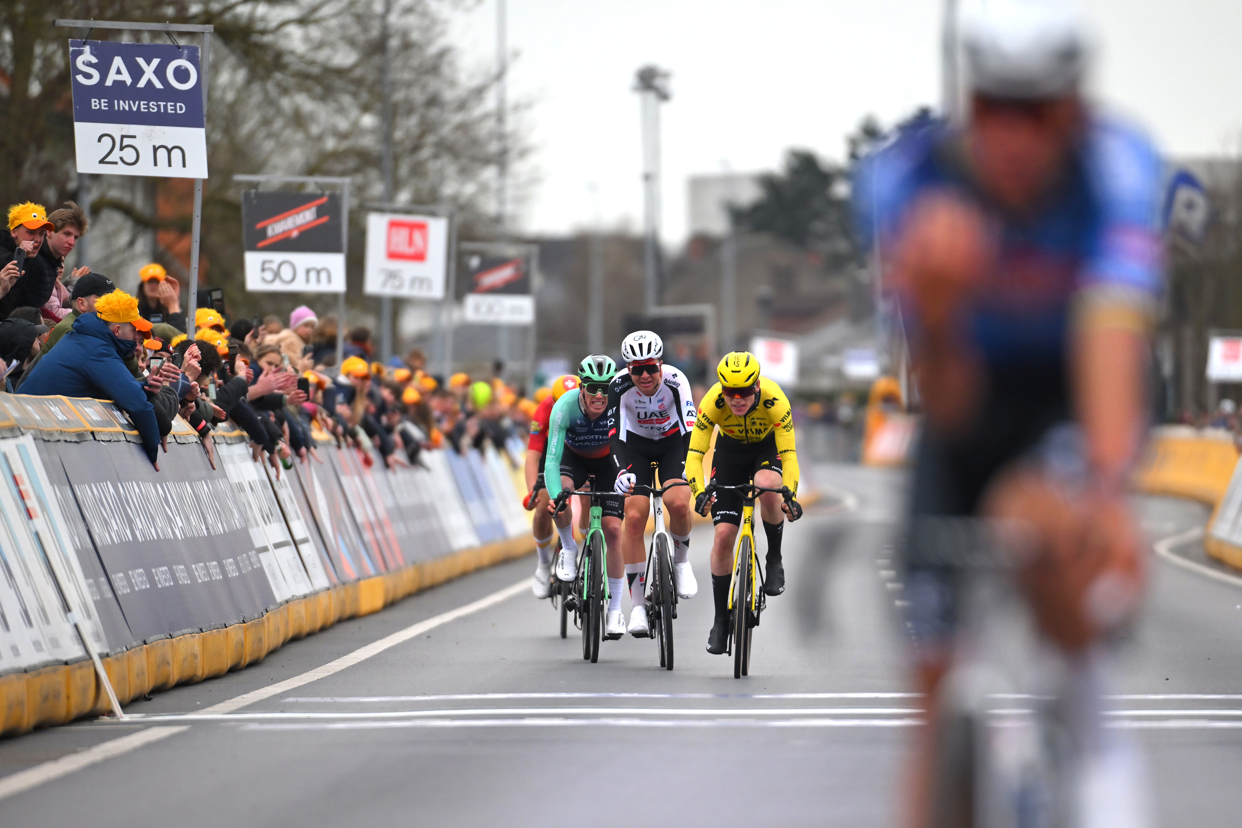 HARELBEKE, BELGIUM - MARCH 27: (L-R) Stan Dewulf of Belgium and Team Decathlon CMA CGM, Florian Vermeersch of Belgium and UAE Team Emirates - XRG and Per Strand Hagenes of Norway and Team Visma | Lease a Bike sprint at finish line during the 68th E3 Saxo Classic 2026 a 208.5km one day race from Harelbeke to Harelbek / #UCIWT / on March 27, 2026 in Harelbeke, Belgium. (Photo by Tim de Waele/Getty Images)