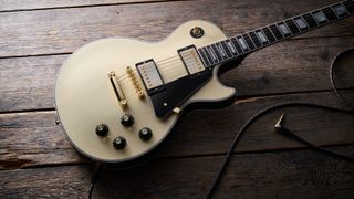 Gibson Les Paul Custom 70s in Buttercream (off-white) finish with gold hardware, block inlays and split-diamond headstock