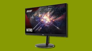 a large gaming monitor against a green background