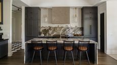 kitchen with dark cabinets and a large island