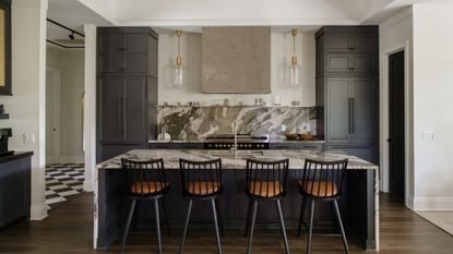kitchen with dark cabinets and a large island