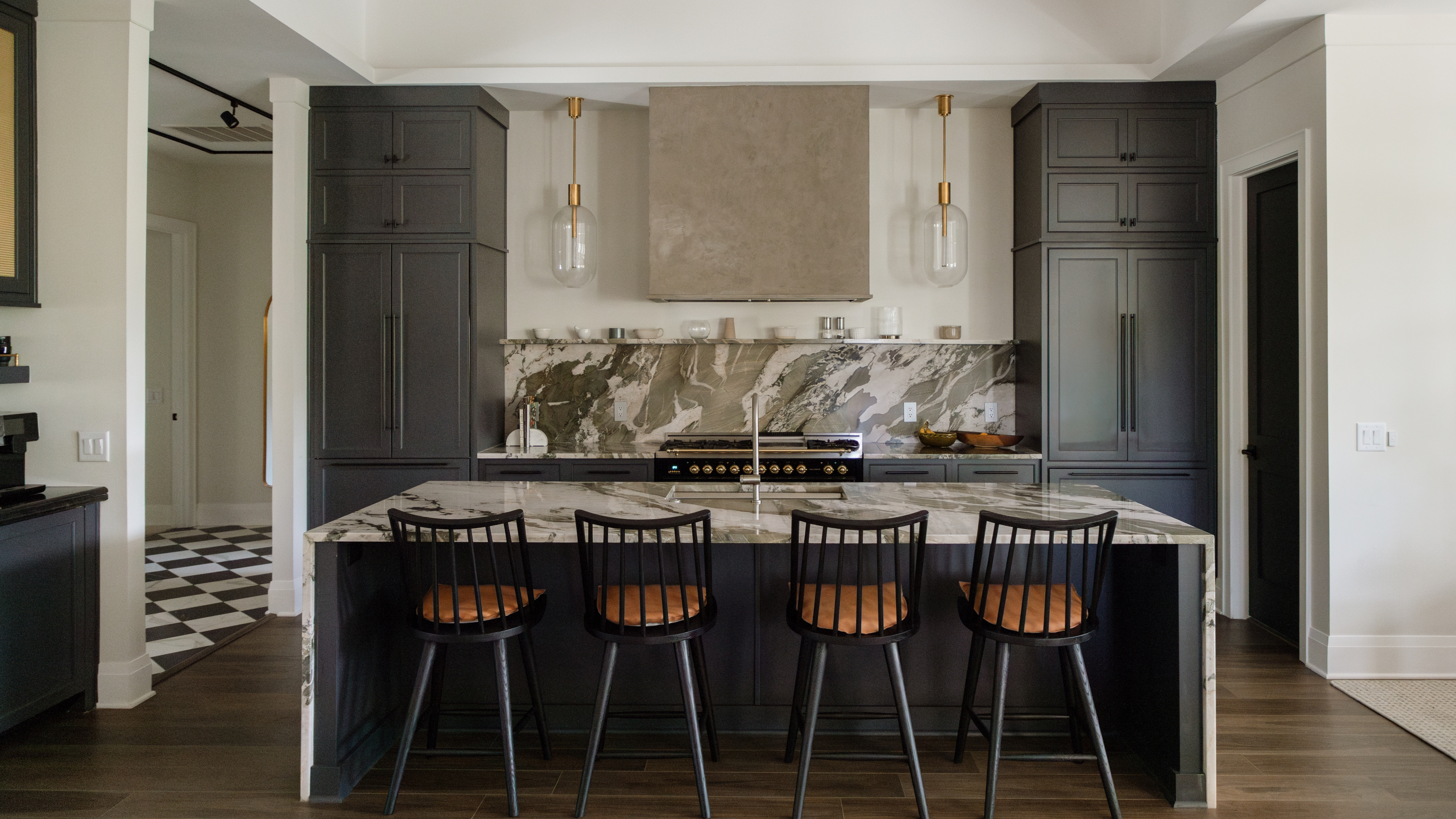 kitchen with dark cabinets and a large island