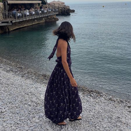 @aimeesong on the beach in a maxi dress and sandals