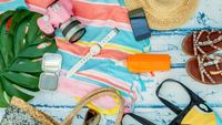 top view woman summer items to go to beach
