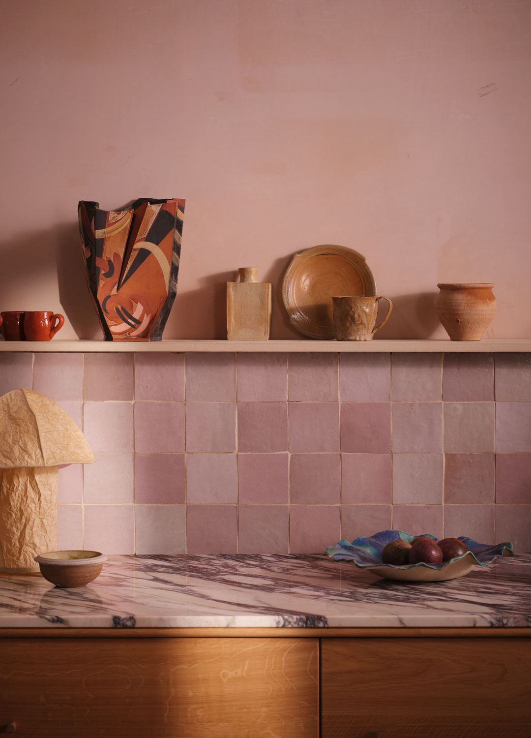 tile drenching in pink kitchen with pink walls and pink wall tiles