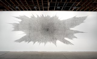 The anchor of the exhibition is 'Walldrawing 2013', an installation featuring 120,000 lines of text, stamped directly onto the white wall of the gallery.
