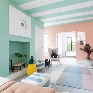 living room with armchair and pink walls