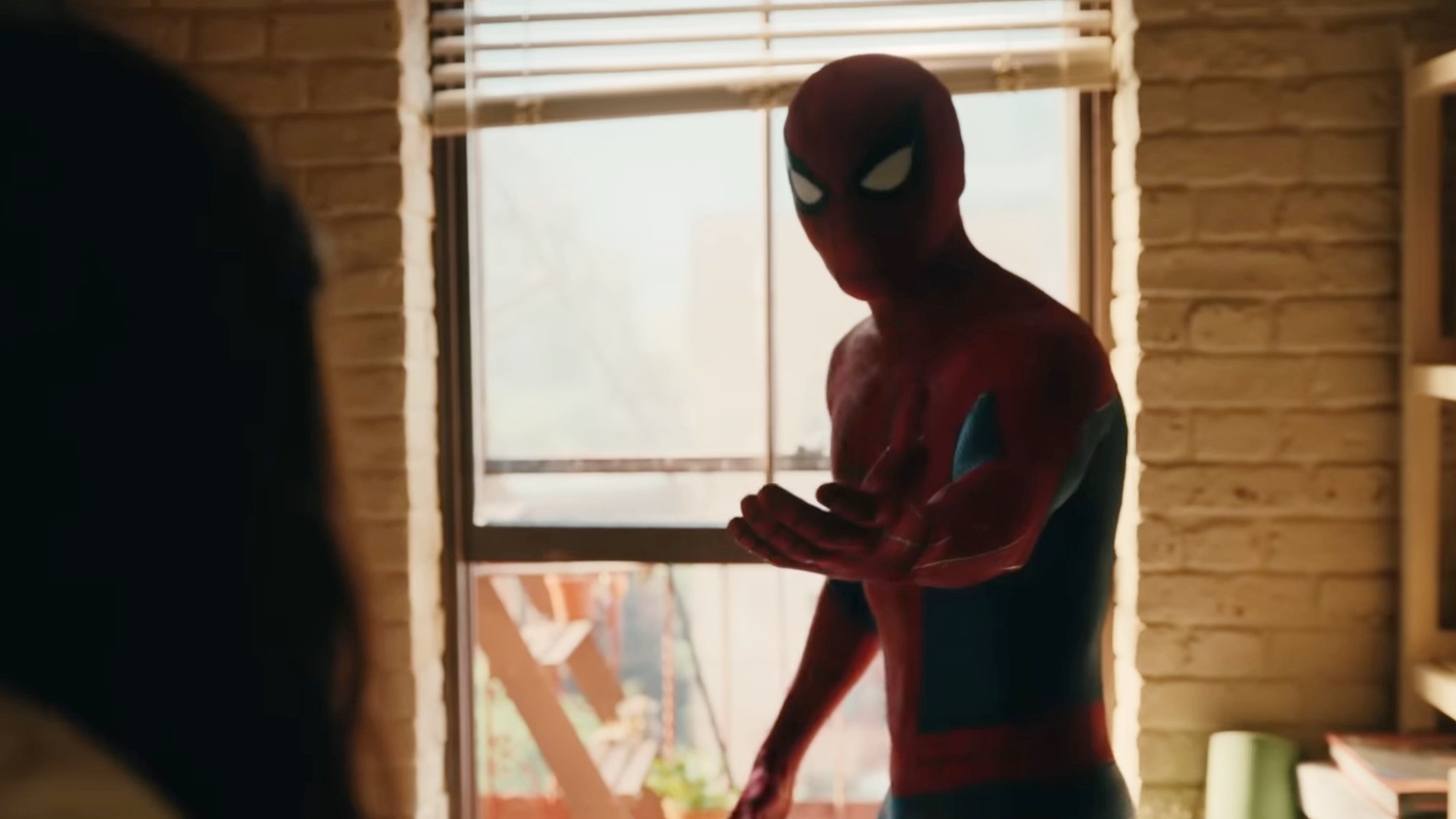 Spider-Man reaching hand out for MJ in Spider-Man: Brand New Day.
