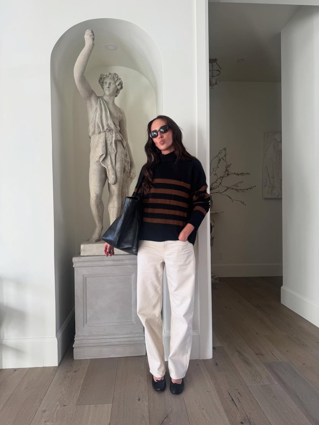 Makenna Alyse McReynolds wearing a white jeans outfit.