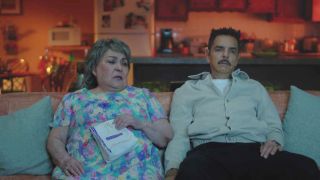 Carmen Salinas and Eugenio Derbez sitting on the couch in The Valet