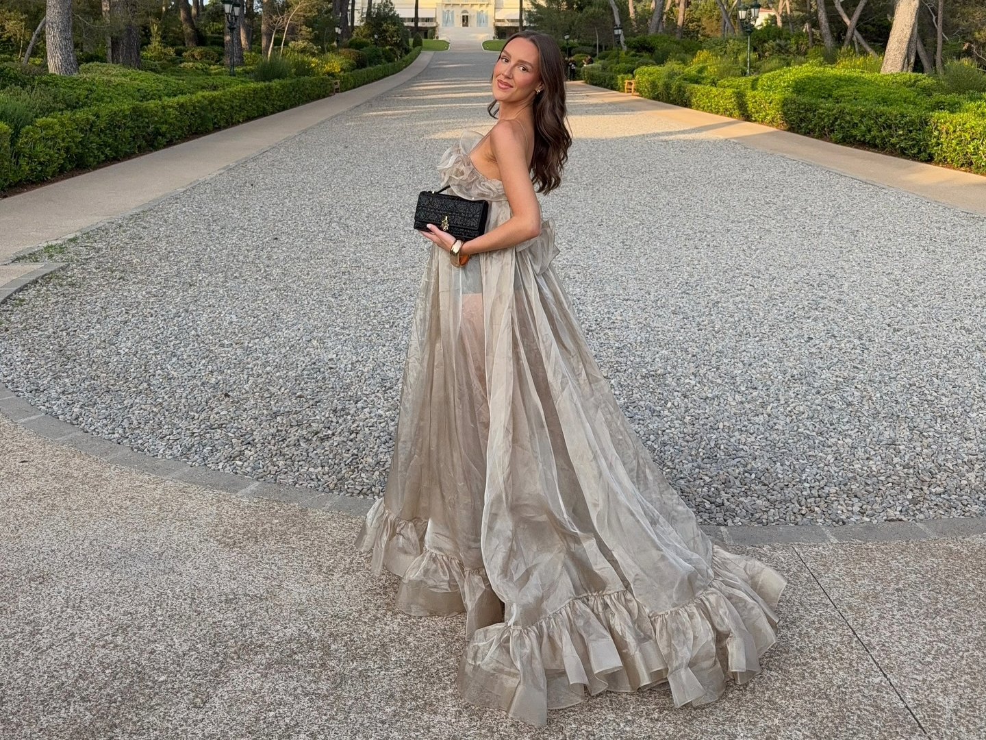 Emma Leger in a silver Zimmermann gown at Hotel du Cap Eden Roc.