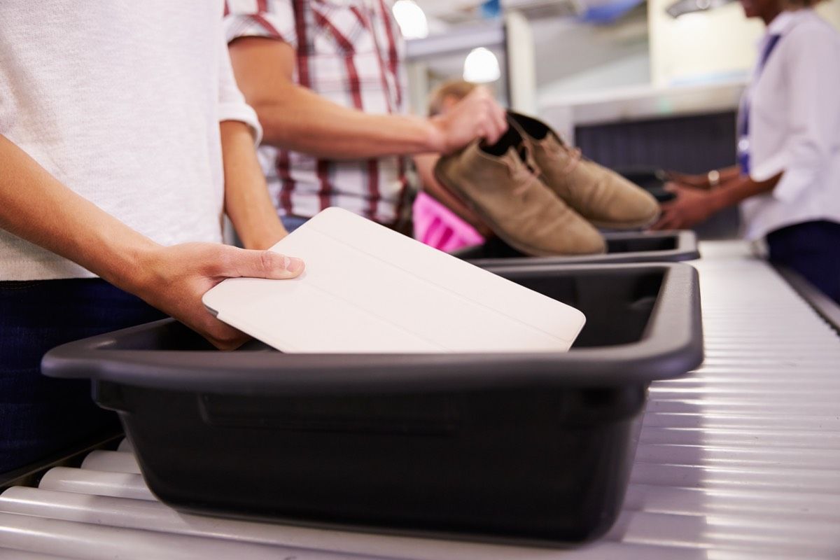 Airport security line, checking bags. 