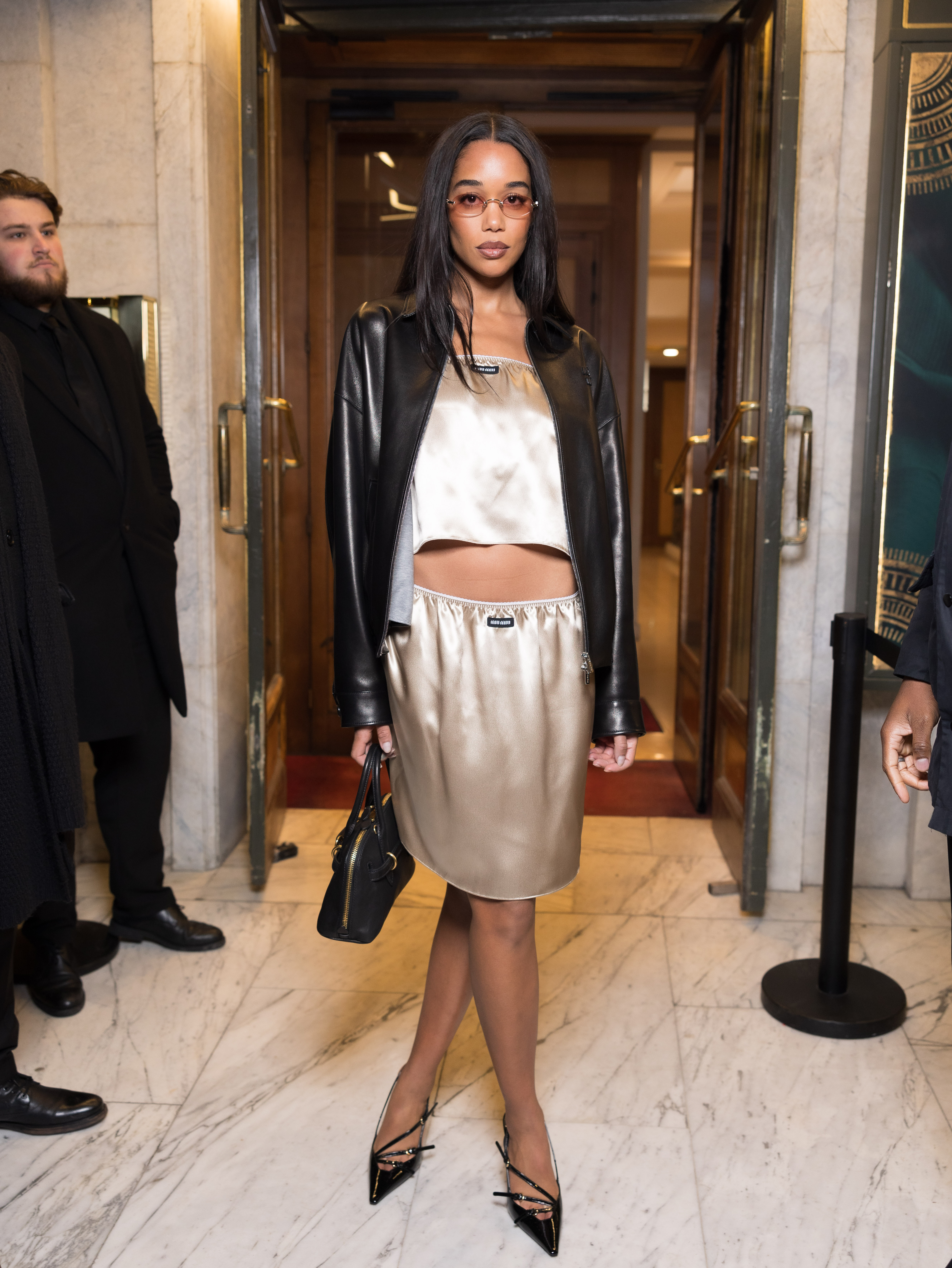Laura Harrier wearing satin outfit