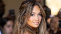 Jennifer Lopez stares right at the cameras while dressed to the nines at 2026 Paris Fashion week. 