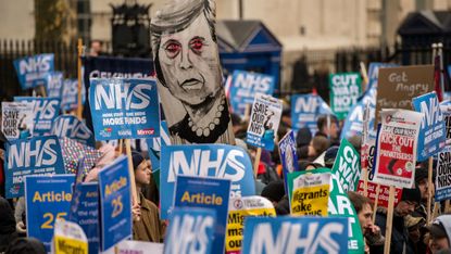 Thousands of people marched on Downing Street to protest NHS cuts