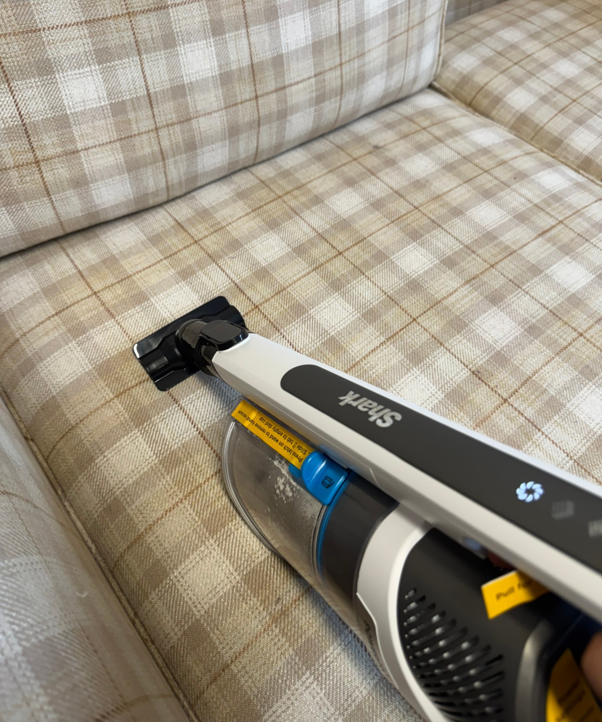 Shark PowerPro Pet vacuuming sofa using upholstery tool in Bristol ARC
