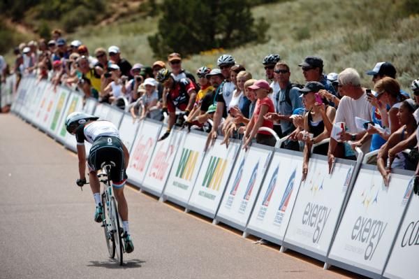 Fans practice their cheering as riders warm up on the course.