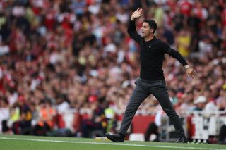 Arsenal manager Mikel Arteta gives instructions to his side during the Premier League match between Arsenal FC and Fulham FC at Emirates Stadium on August 27, 2022 in London, England.