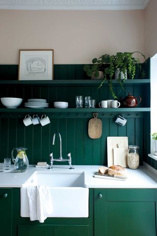 a pink and green kitchen