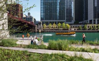 The 1.5 mile long riverwalk is composed of a series of dynamic walkways with stainless steel canopies under bridges