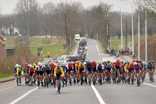 NOKERE BELGIUM MARCH 16 A general view of the peloton passing through a landscape during the 76th Danilith Nokere Koerse 2022 Mens Elite a 1898km one day race from Deinze to Nokere NokereKoerse DNK22 on March 16 2022 in Nokere Belgium Photo by Luc ClaessenGetty Images