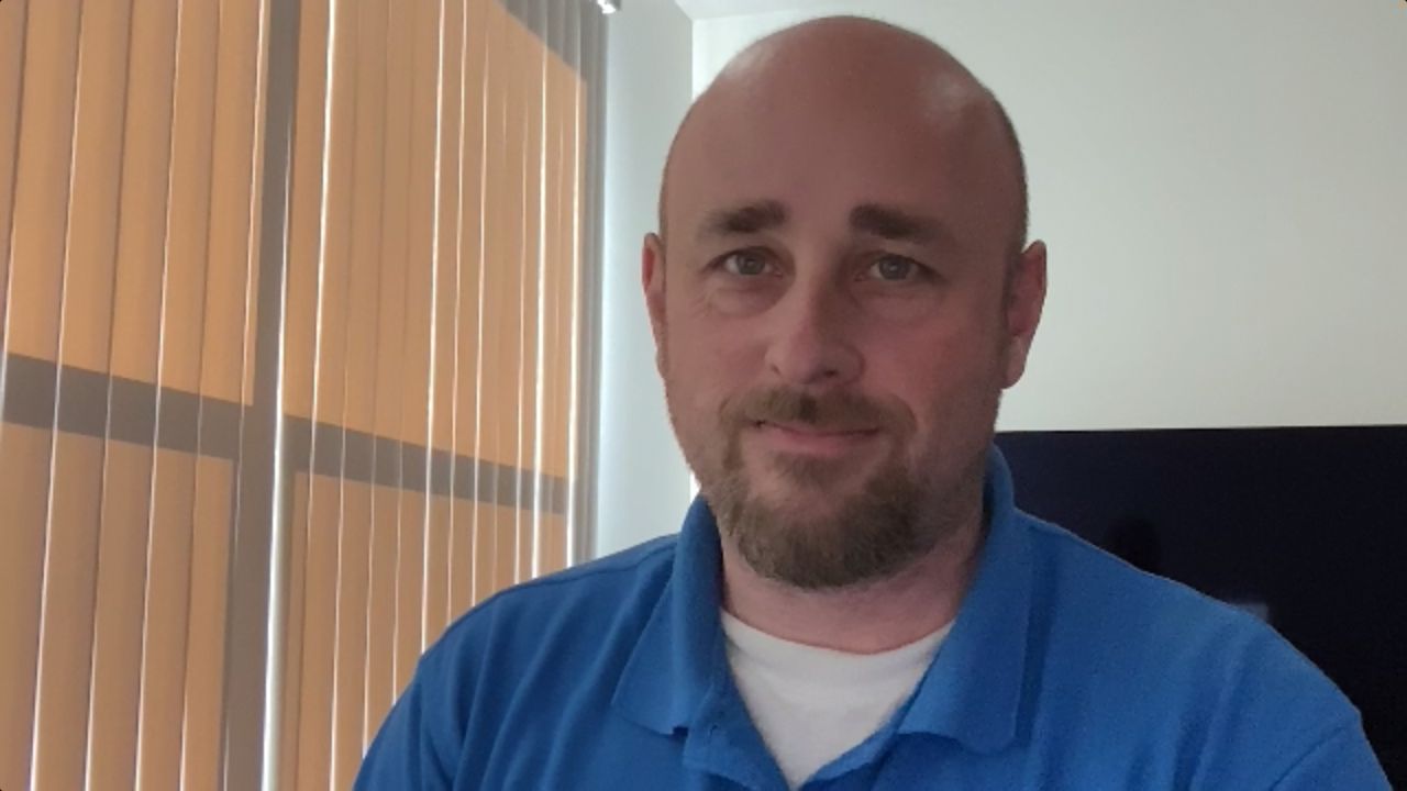 Apple Studio Display webcam in Zoom, blinds closed