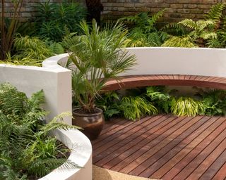 circular deck area with walls and planting