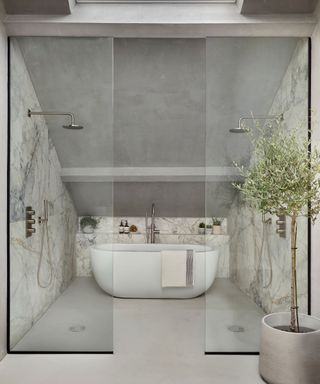 A large wet room with a freestanding bath and double shower