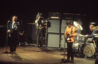 (from left) Jack Bruce, Eric Clapton, and Ginger Baker perform live onstage at the Royal Albert Hall in London