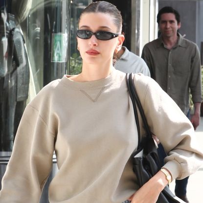 Hailey Bieber elevated her neutral crewneck with cigarette jeans and the Spring 2026 high-vamp heels trend.