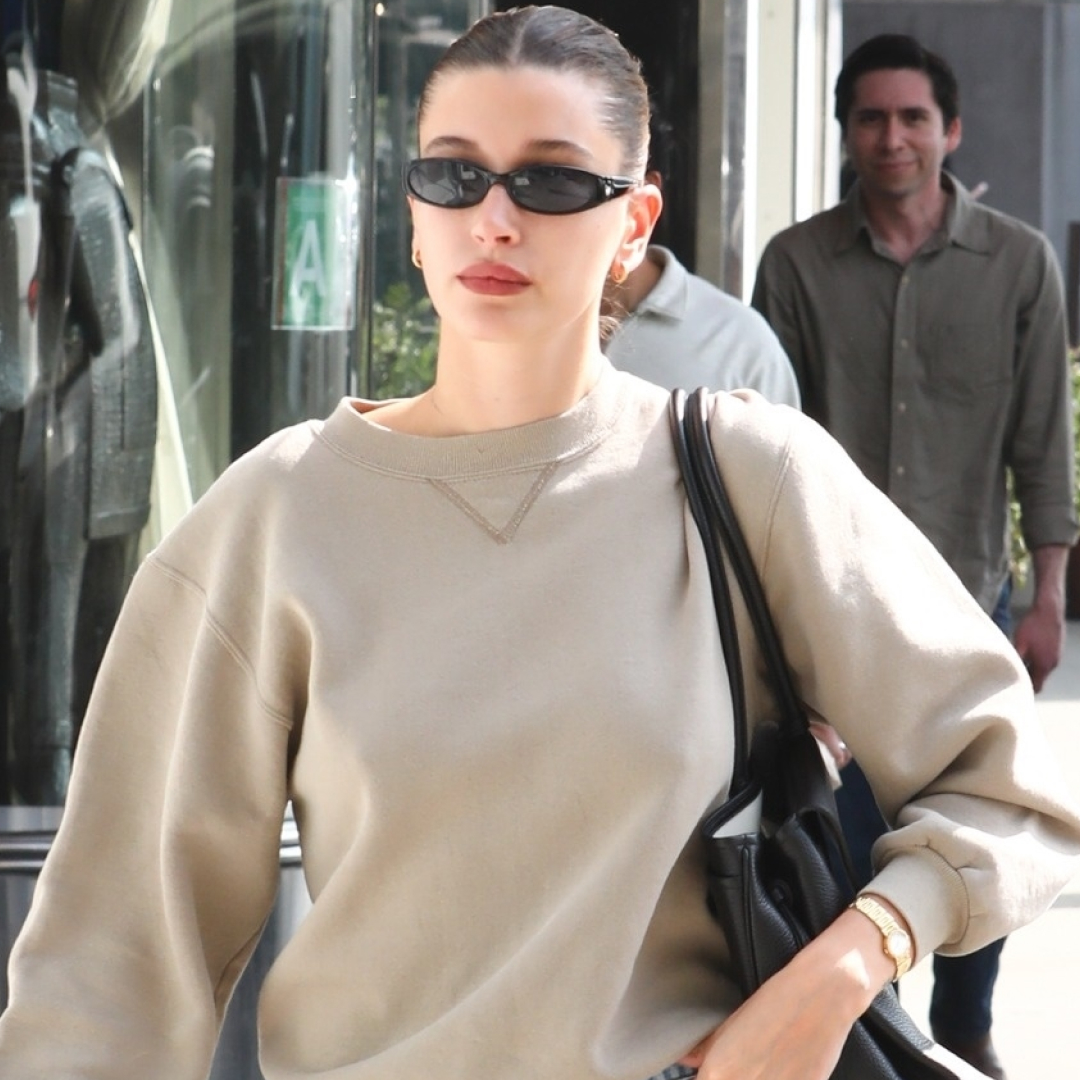 Hailey Bieber elevated her neutral crewneck with cigarette jeans and the Spring 2026 high-vamp heels trend.